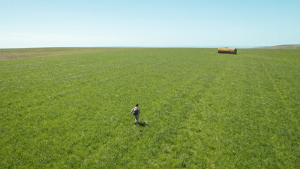 backpacker hiking on sunny day, on the Pewsey Downs, Wiltshire, south of Marlborough, United Kingdom
