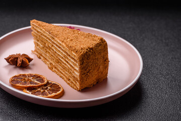 A slice of honey puff cake or pumpkin, carrot and cream pie, vegan sweets