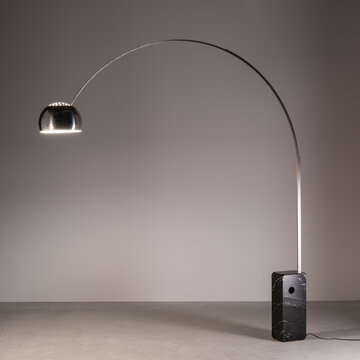 Arco floor lamp, designed by Achille Castiglioni, with stainless steel arch, aluminum shade and black marble base. Udine, Italy. February 5, 2025.
