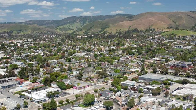Aerial drone view of San Luis Obispo California suburb - homes, trees, hills 06