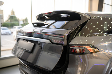 Close up view of the rear part of the modern grey car