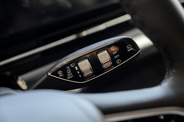 Close up view of car light switch control. Headlight switch, turn signal lever