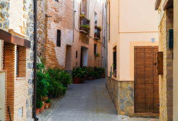 Beautiful old street decorated with flowers and plants, in Jérica, Comunidad Valenciana (Spain). 