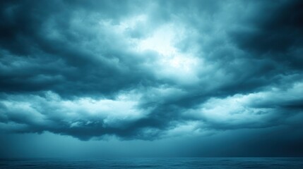 Dark, ominous storm clouds gather over the sea