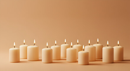 Symmetrical Array of Lit White Candles on Light Brown Backdrop Creating a Warm and Minimalist Atmosphere for Stock Photo