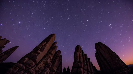 video of Time lapse animation glowing rock pillars mystical moon rising surreal terrain stars perfect fantasy sci fi backgrounds - Powered by Adobe