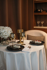 table setting in a restaurant, table for two. date or dinner in a restaurant, vertical image