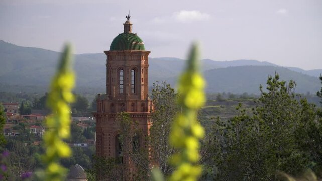 J&eacute;rica's mudejar tower bell framed on flowers. In comunidad Valenciana, Spain.