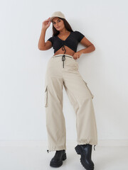 Casual fashion model in beige cargo pants
