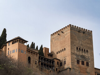 View of the Comares Tower of the Alhambra from the Paseo de los Tristes in Granada (Spain)