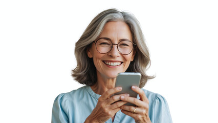 Fototapeta premium Cheerful older woman is smiling broadly while holding and looking at a smartphone