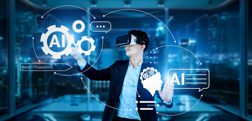 Smart project manager pointing at AI chat hologram and wearing headset at modern office. Professional businessman working on augmented reality goggles with blurring background. Technology. Ingenuity.