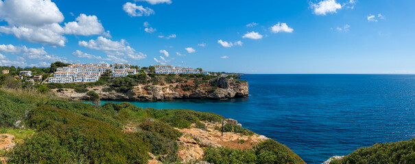 Panoramic View of Cala Romantica Mallorca with Cliffs and Turquoise Mediterranean Sea