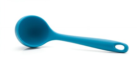 Teal colored ladle against white background