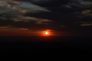 burning sunset in the black forest mountains