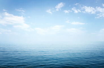 Fototapeta premium View of the sea or ocean and the sky with clouds. A good background for the theme of travel, summer vacation.