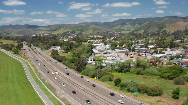 Aerial drone view of San Luis Obispo California suburb - homes, trees, hills 01