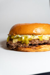 hamburger on a white background, with pickle and trouffle