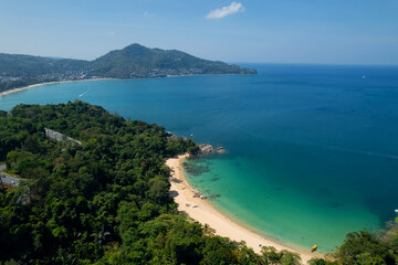 Scenic view of haad laem sing beach with turquoise waters and lush greenery in phuket, thailand