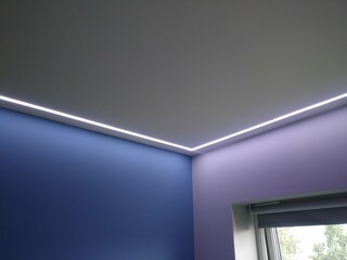 Modern Interior Ceiling with LED Strip Lighting and Dual Wall Colors