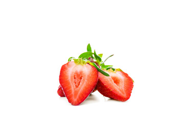 Fresh ripe strawberry cut in half on white background. Sweet and juicy summer fruit isolated.