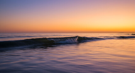Obraz premium Vibrant Wave Shimmers Under Coastal Sunset Warmth And Tranquility