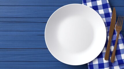 A clean white plate positioned on a blue wooden table, accompanied by a checkered napkin and cutlery