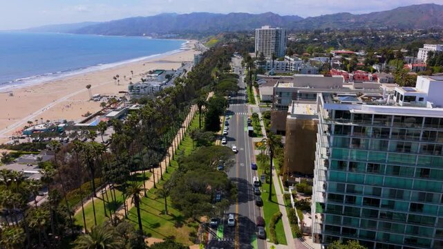 Aerial Forward Flight Over Santa Monica Oceanfront Road and Beach, California