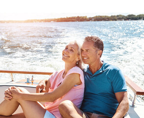 Fototapeta premium Man, woman and retirement on boat cruise for travel, vacation and tropical adventure in Bahamas. Mature couple, love and luxury yacht for holiday, getaway and anniversary on ocean sailing to relax