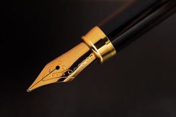 Fountain pen, the tip of a beautiful fountain pen in detail, selective focus.