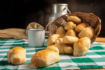 Homemade bread, a beautiful breakfast table with delicious homemade bread on a rustic wooden surface with a tablecloth, selective focus.