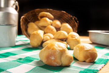 Homemade bread, a beautiful breakfast table with delicious homemade bread on a rustic wooden surface with a tablecloth, selective focus.