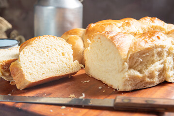 Homemade bread, a beautiful breakfast table with delicious homemade bread on a rustic wooden surface with a tablecloth, selective focus.