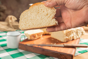 Homemade bread, a beautiful breakfast table with delicious homemade bread on a rustic wooden surface with a tablecloth, selective focus.