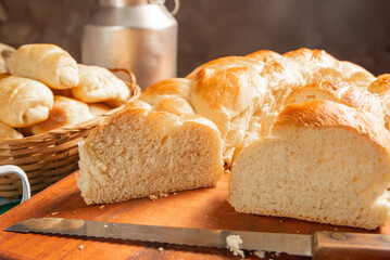 Homemade bread, a beautiful breakfast table with delicious homemade bread on a rustic wooden surface with a tablecloth, selective focus.