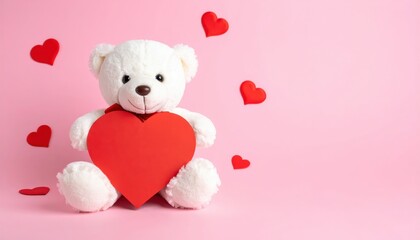 A fluffy white teddy bear holds a bright red heart against a soft pink background, evoking feelings of love and warmth.