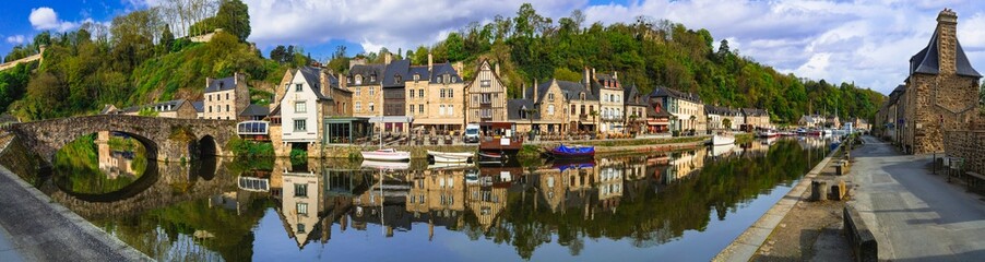 France travel, most scenic villages and romantic towns of Brittany. Picturesque traditional port of Dinan with half-timbered houses, restaurants over canals