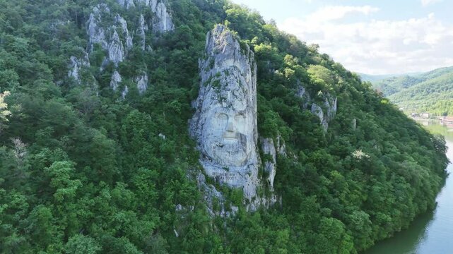 Drone footage of statue of a head on Danube river, Romania