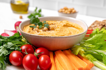 Homemade hummus with vegetables sticks  and multigrain crackers. vegan food healthy eating