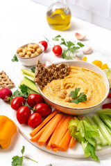 Homemade hummus with vegetables sticks  and multigrain crackers. vegan food healthy eating
