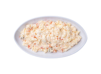 Russian salad or mayonnaise salad in a plate isolated over white background