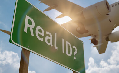 Real ID? Green Road Sign with Low Flying Airplane Just Above with Landing Gear Down.