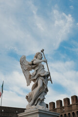 Baroque angel statues on Ponte Sant Angelo in Rome with dramatic sky and classic Roman architecture...