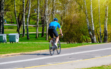 Cyclist ride on the bike path in the city Park

