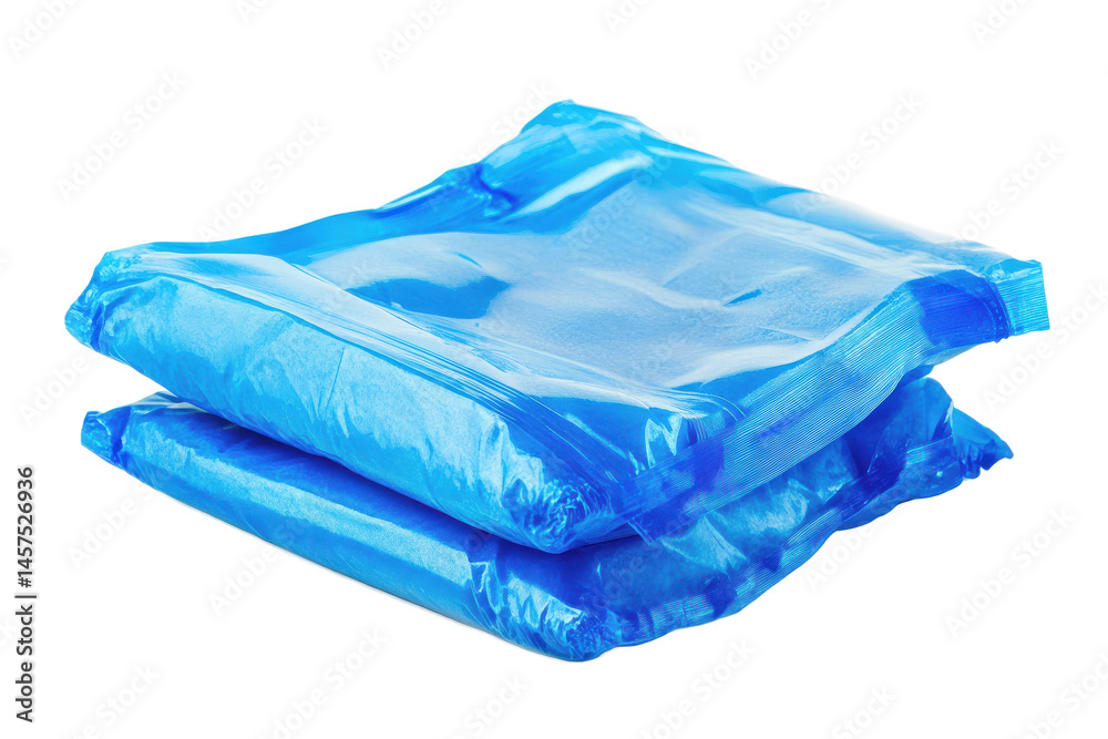 Poster a neatly folded stack of light blue material resting on a dark background creating a simple composit