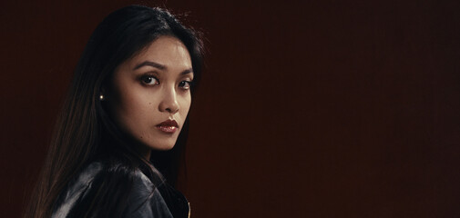 Woman with long hair gazing thoughtfully to the side