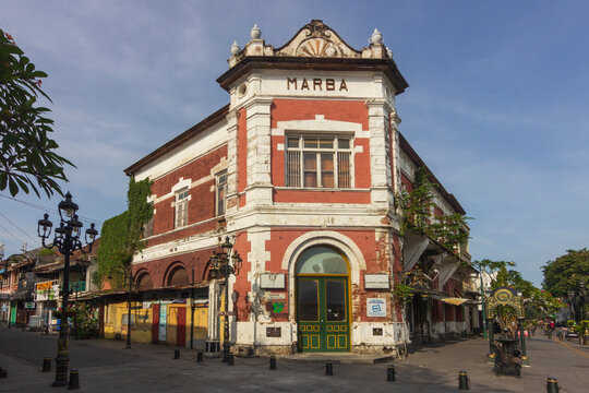 Semarang - Indonesia, May 6, 2025 : View of the historic Marba Building in Kota Lama Semarang, Indonesia, under a partly cloudy sky.