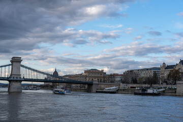 Fototapeta premium Szechenyi Chain Bridge is chain bridge that spans river Danube between Buda and Pest district, western and eastern sides of Budapest, Hungary
