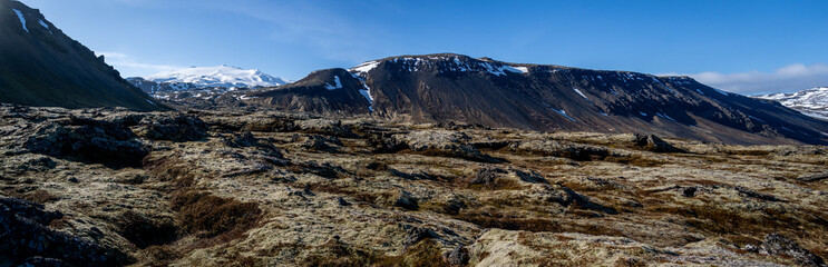 High resolution panoramic view of lava field under the Sn&aelig;fellsj&ouml;kull stratovolcano with the snow capped peak visible to the left. Sn&aelig;fellsnes Peninsula in Western Iceland.