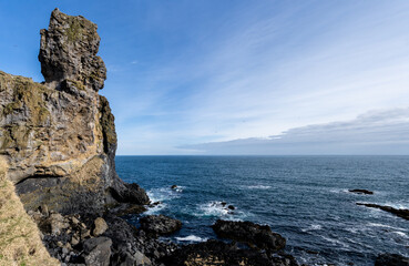 A high resolution view of L&oacute;ndrangar natural volcanic rock tower extending out into the ocean in Sn&aelig;fellsj&ouml;kull National Park in Western Iceland.